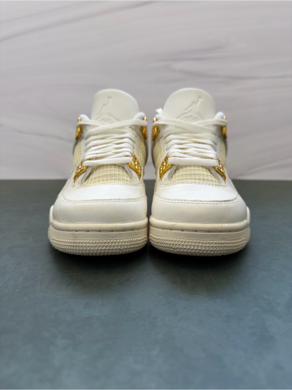 White Women's Jordan Sneakers with Gold Accents